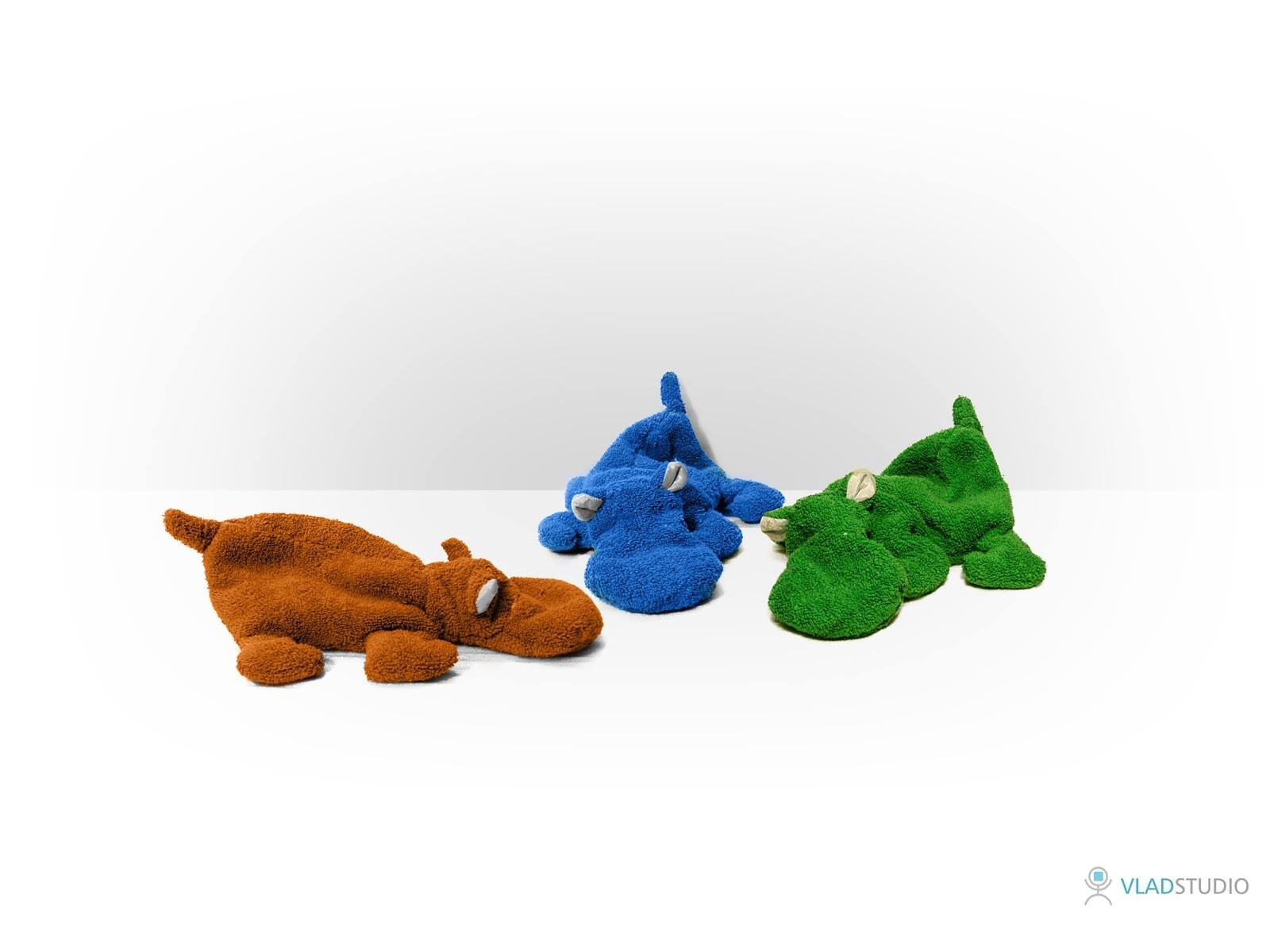 Three plush dinosaur toys