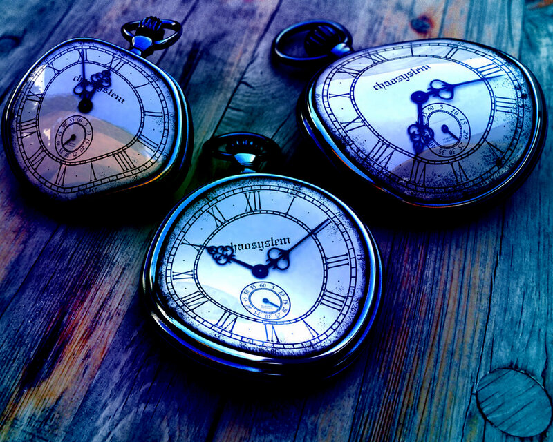 Three pocket watches on wood