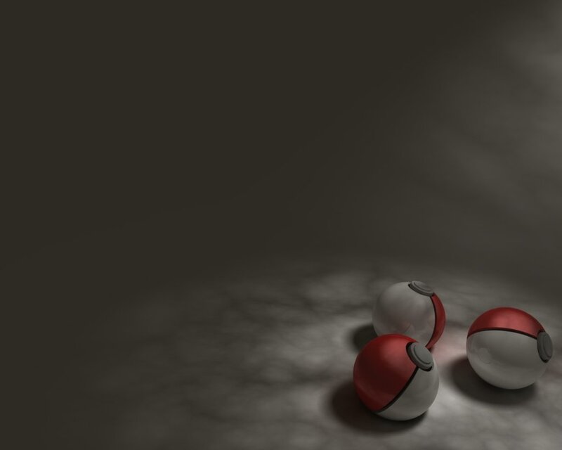 Three Poké Balls on a dark surface