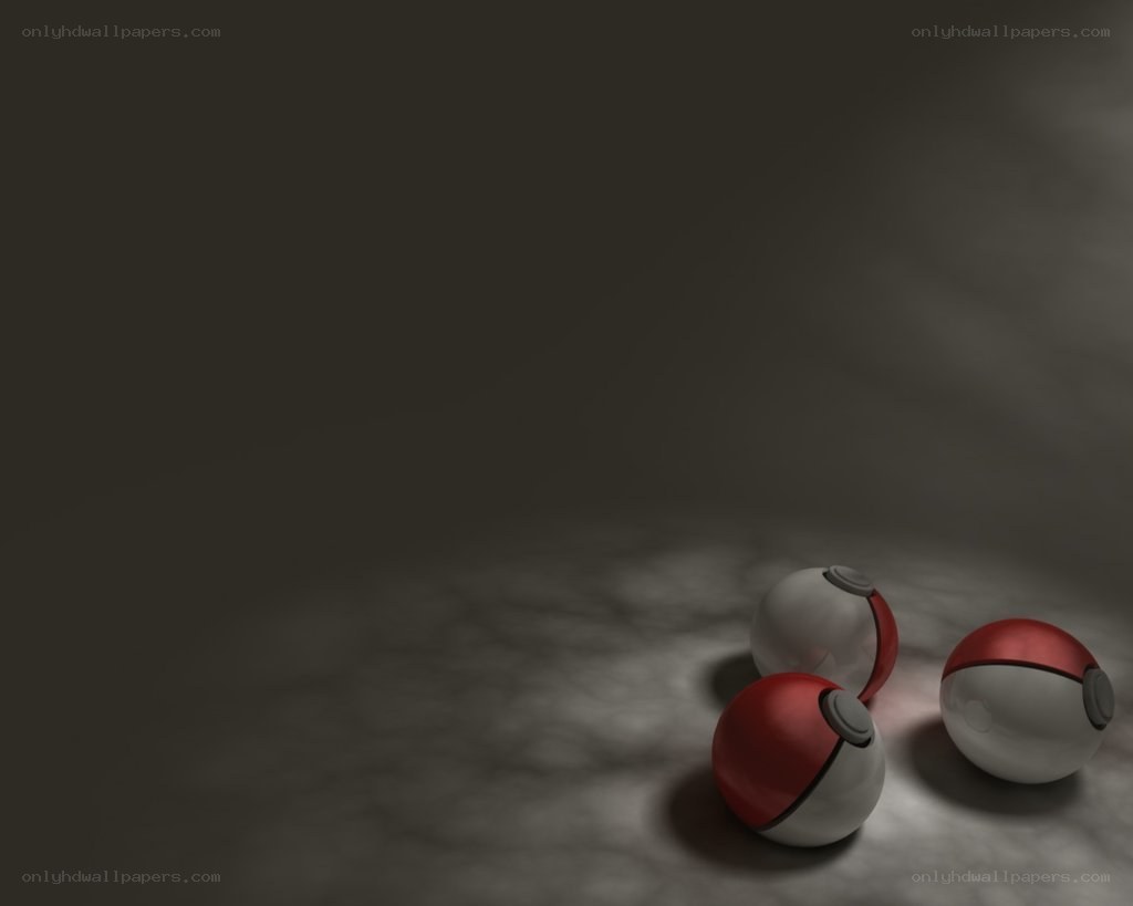 Three Poké Balls on a dark surface