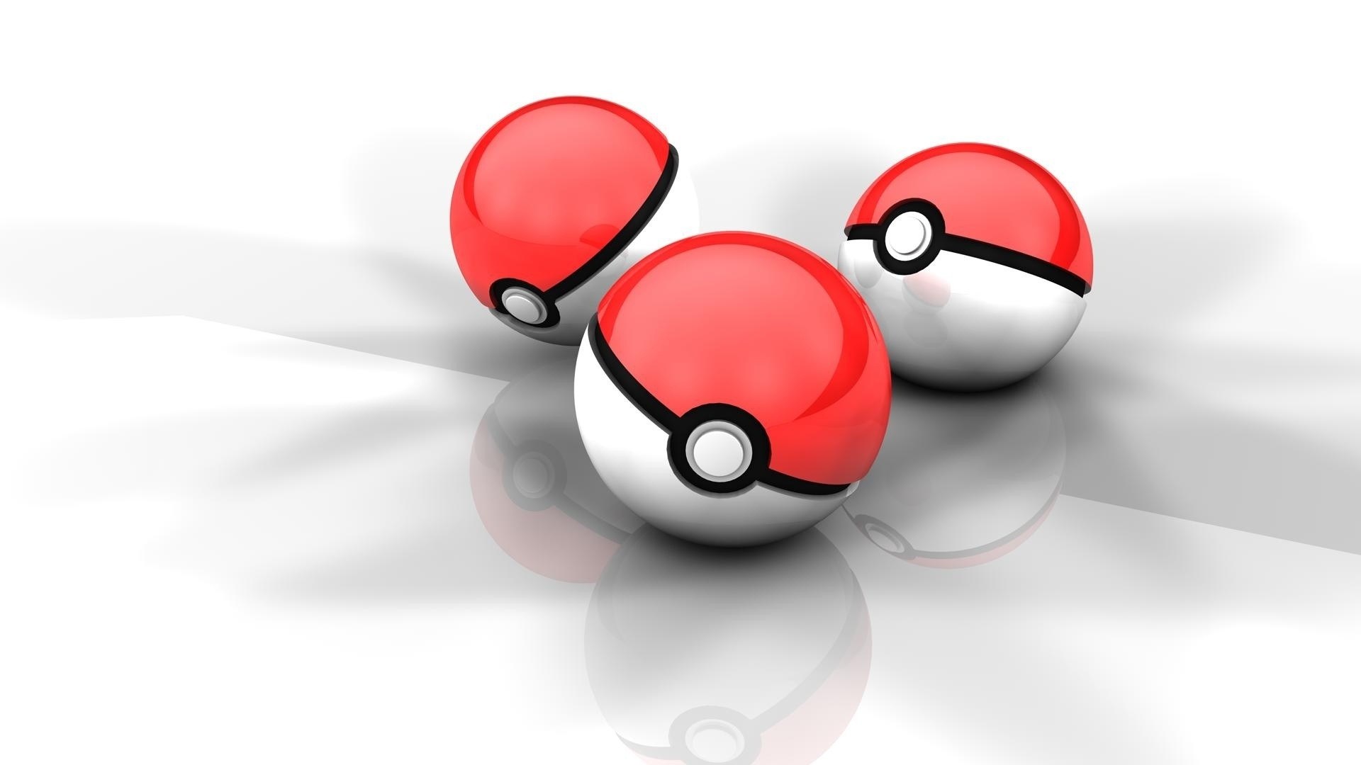 Three Poké Balls on white surface
