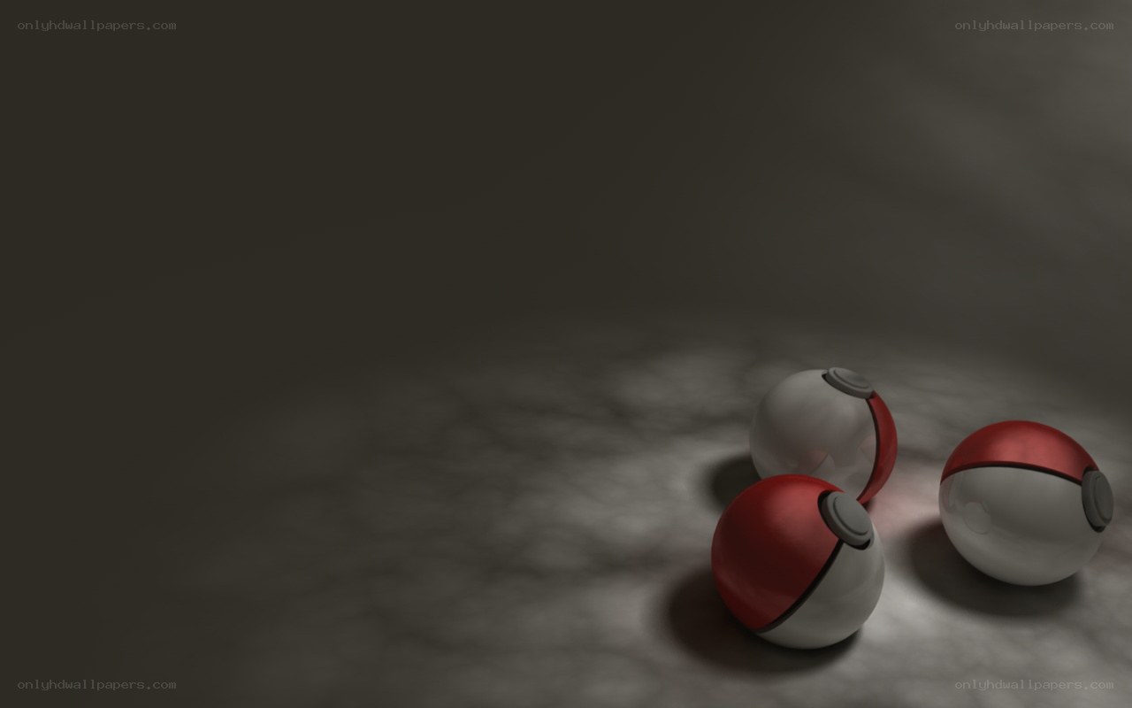 three pokeballs on dark surface