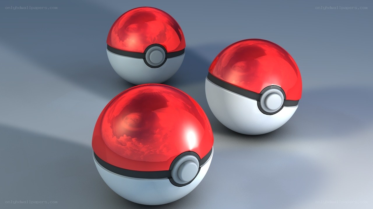 three pokeballs on gray surface