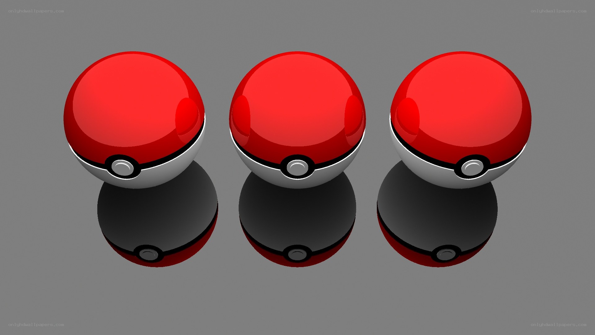 three pokeballs on reflective surface