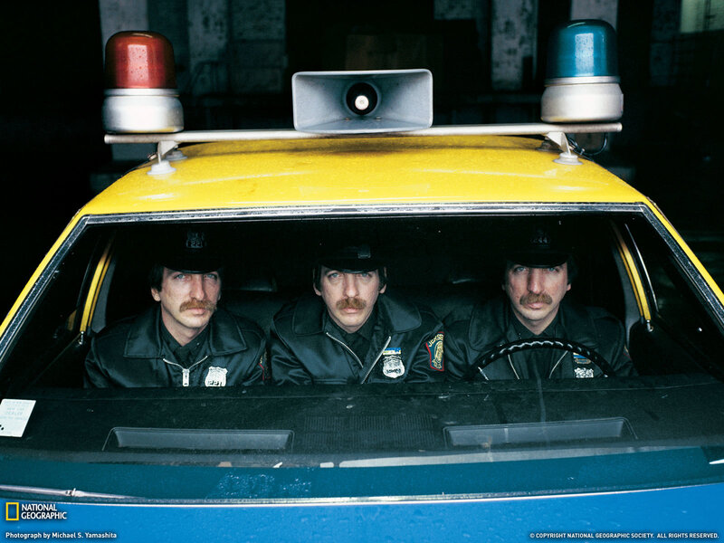 Three police officers in a car