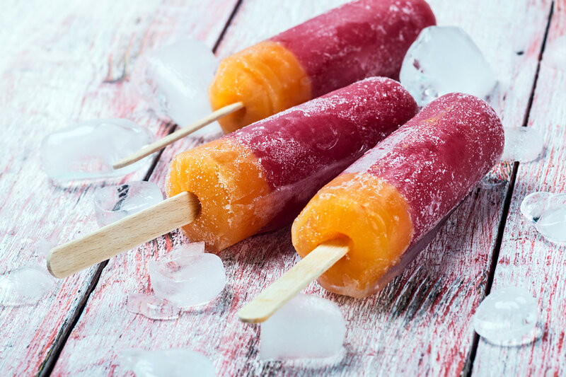 Three Popsicles on Wood