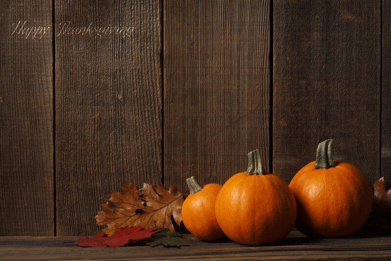 Three Pumpkins on Wood