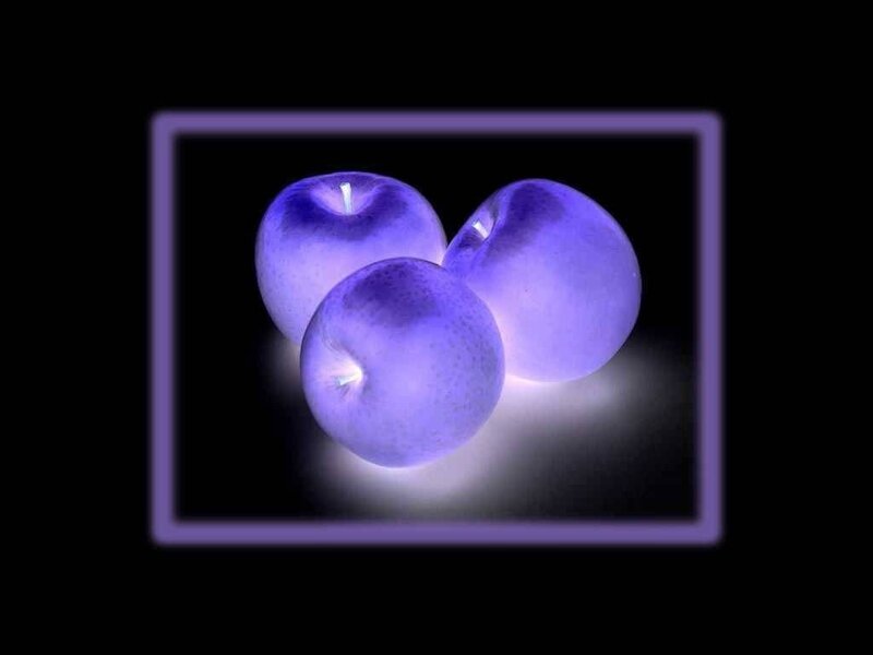 three purple apples in frame