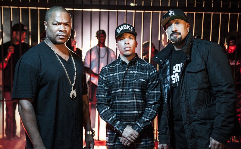 three rappers in front of bars