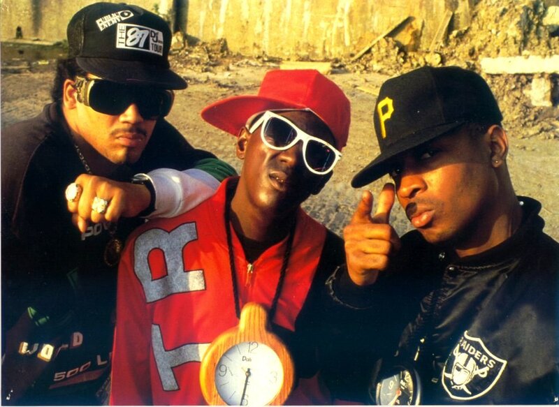 Three rappers posing together