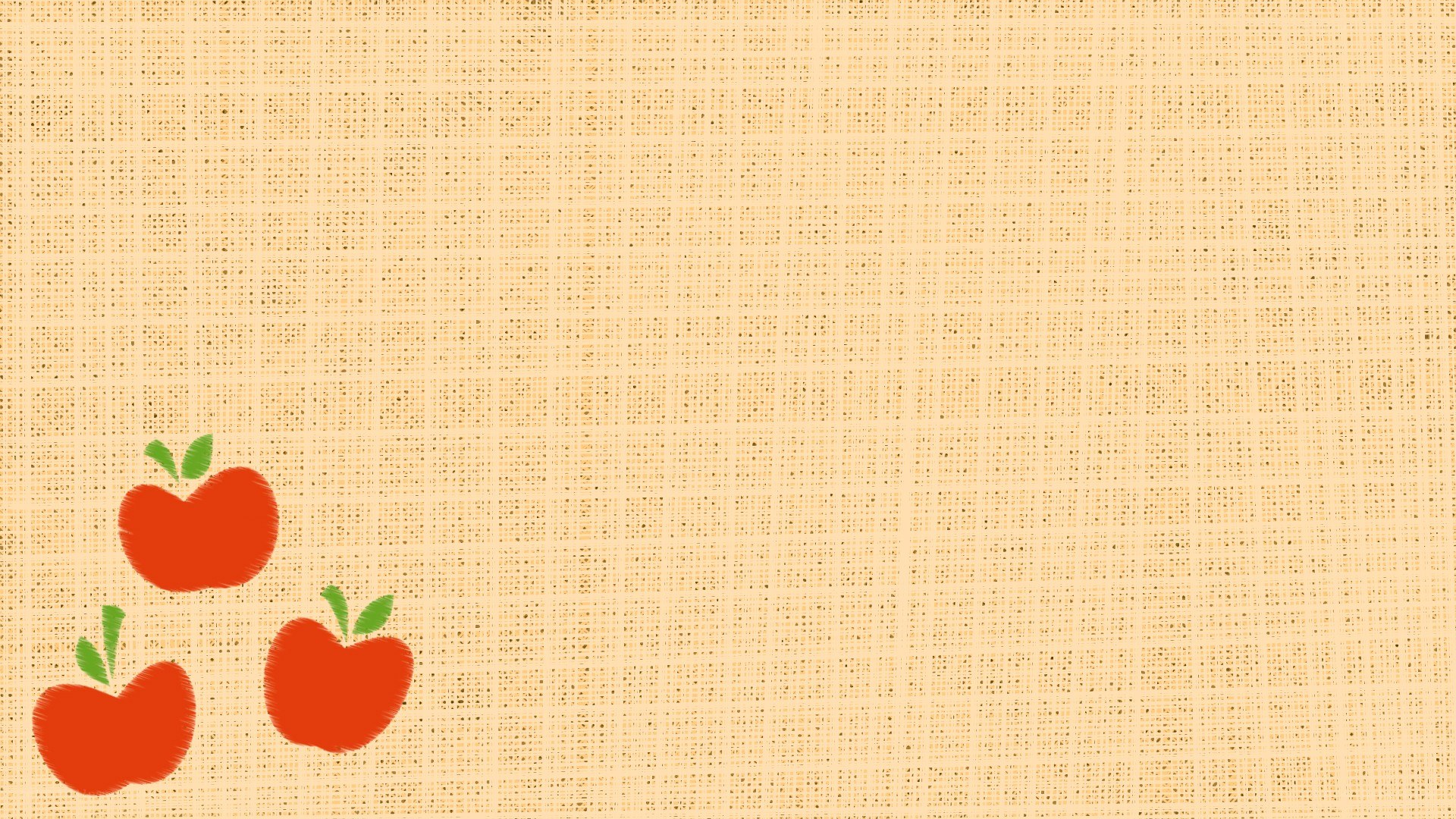 three red apples on burlap