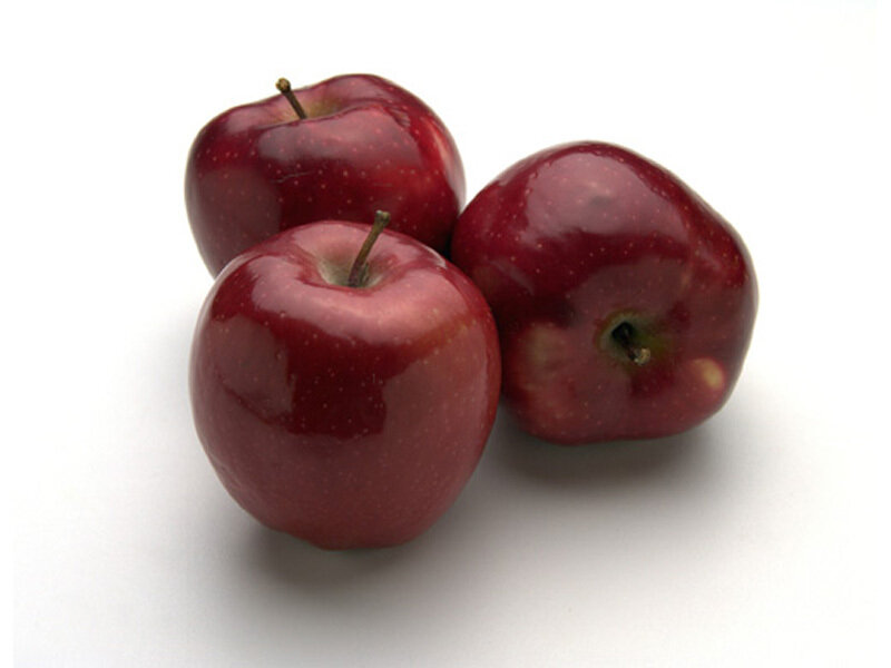 three red apples on white