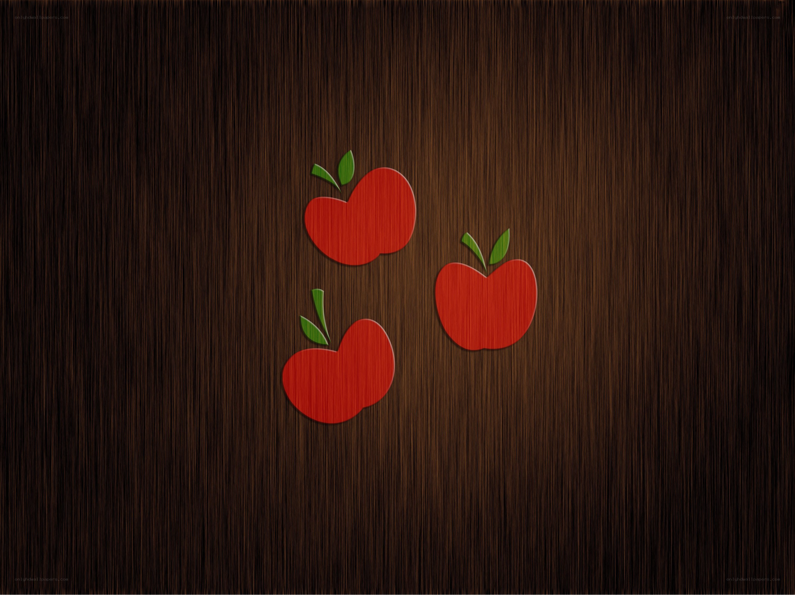 Three red apples on wood