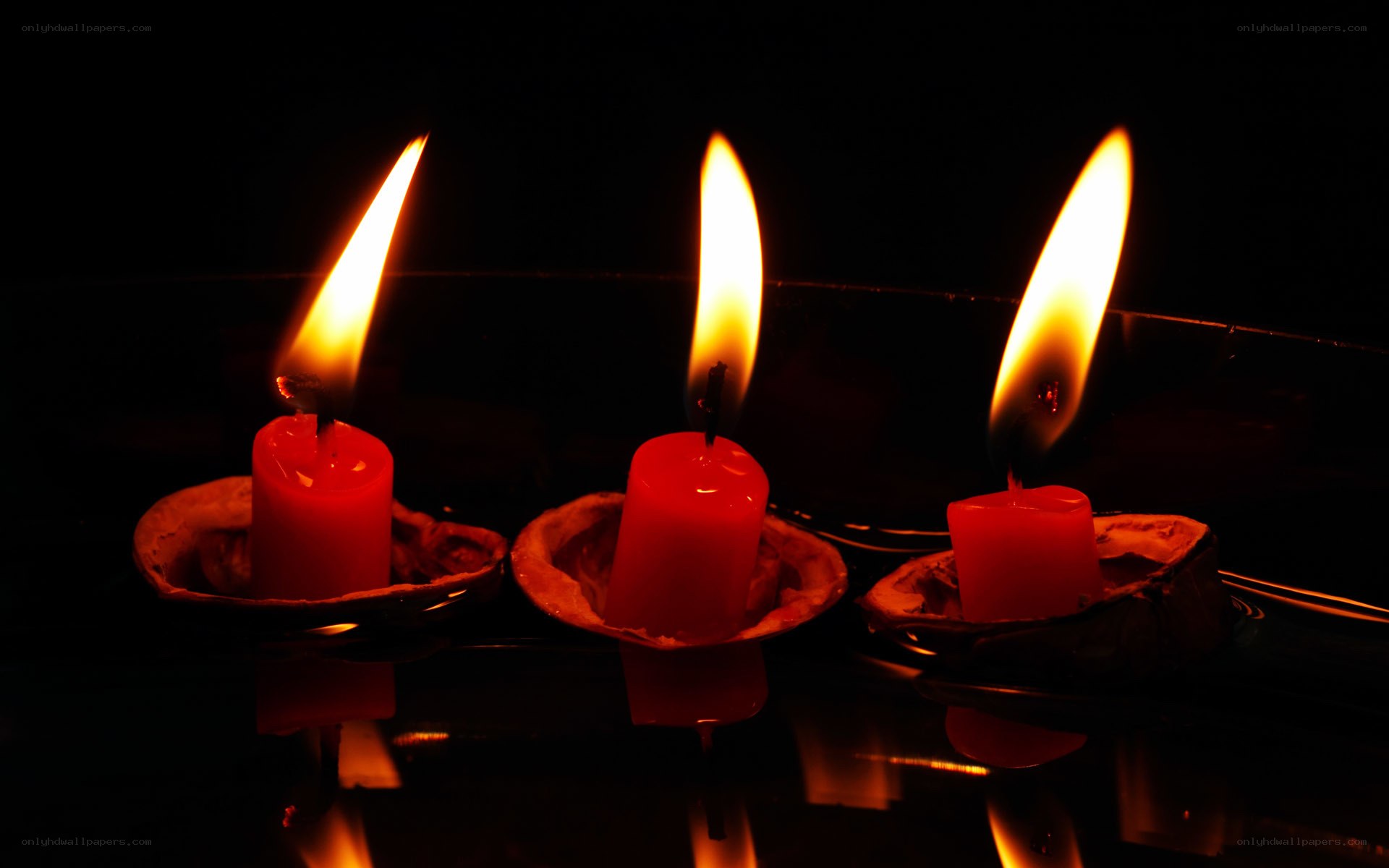 Three red candles burning