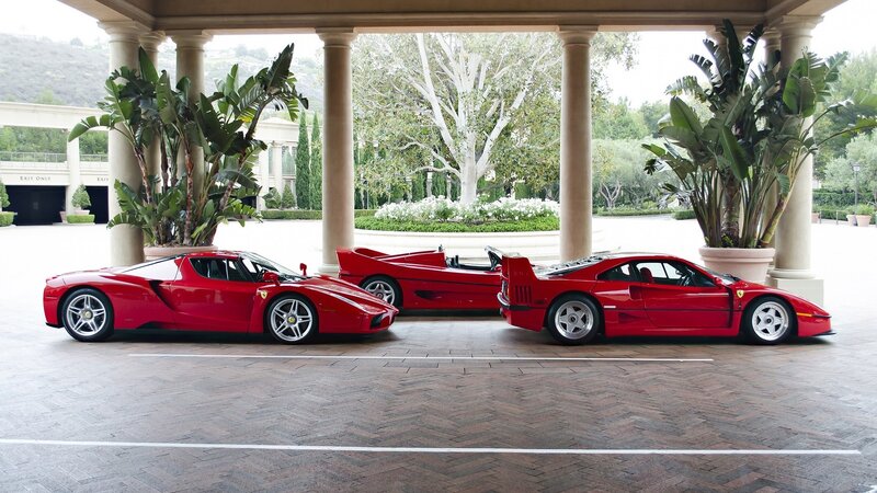 Three Red Ferrari Cars