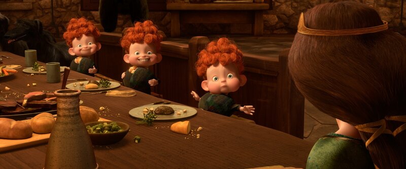 Three red-haired boys at a table