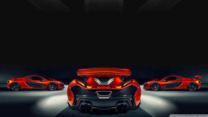 Three red McLaren P1 cars
