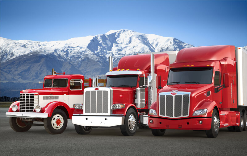 Three Red Peterbilt Trucks