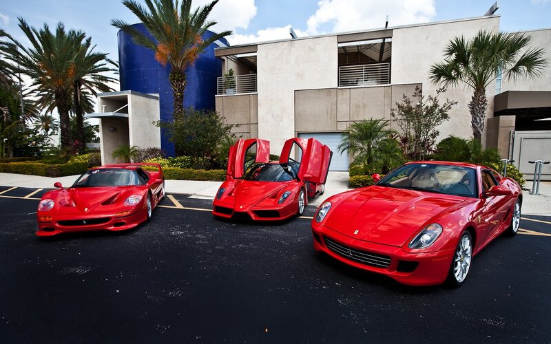 Three Red Sports Cars
