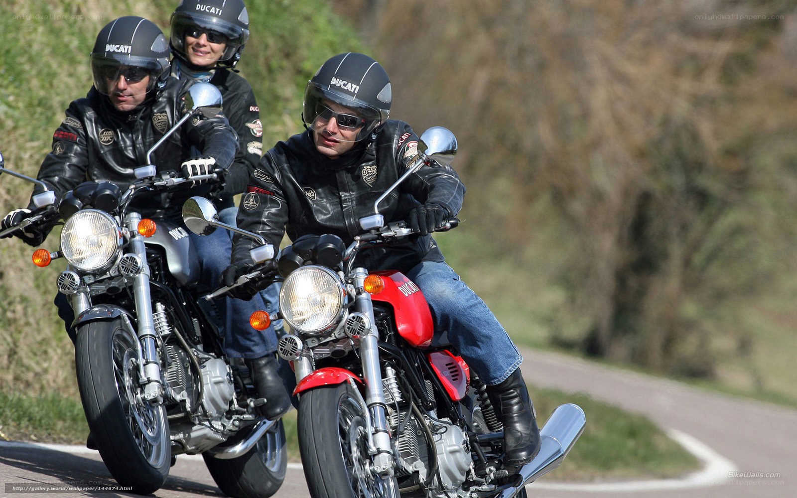Three riders on Ducati motorcycles