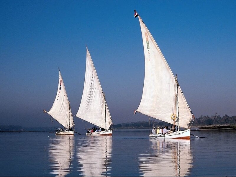 Three Sailboats on River