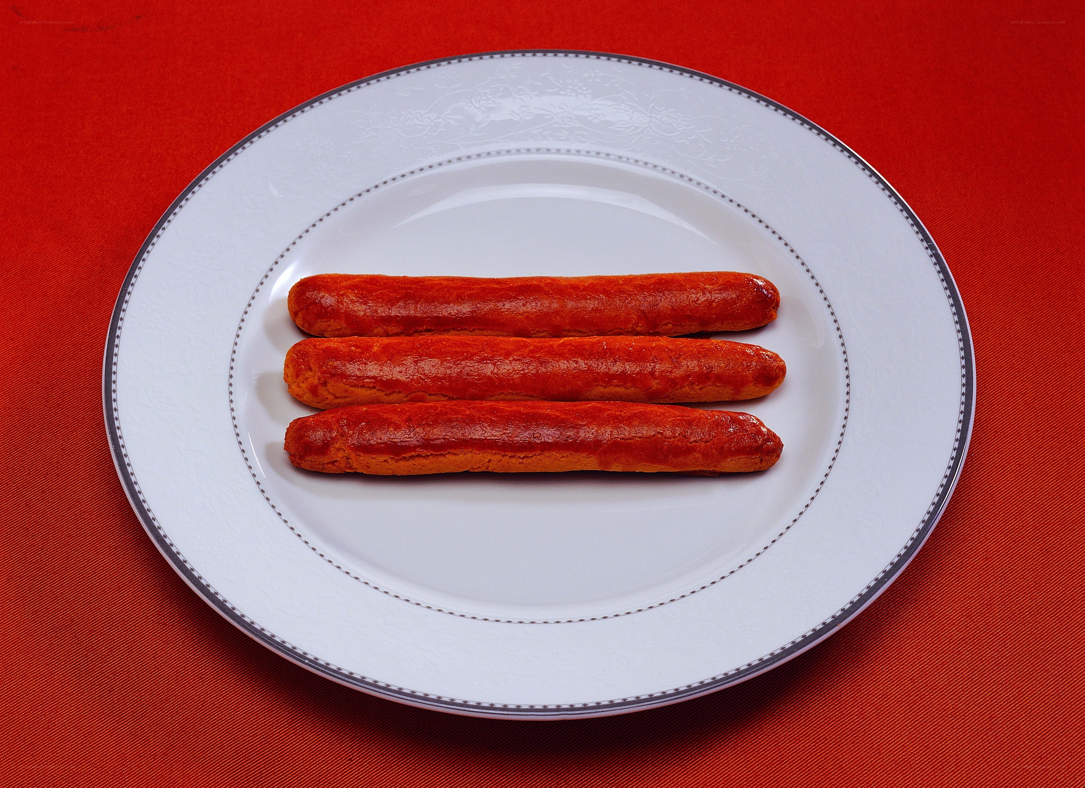 three sausages on a plate