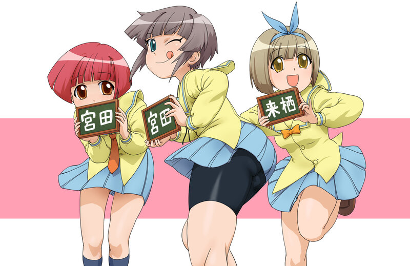 three schoolgirls holding signs
