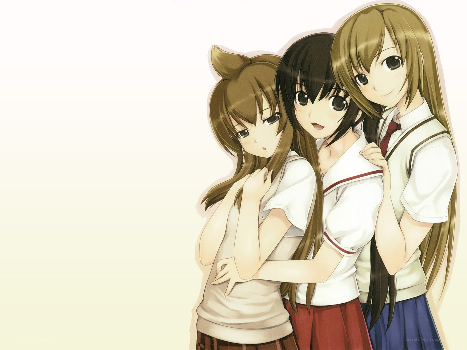 three schoolgirls hugging
