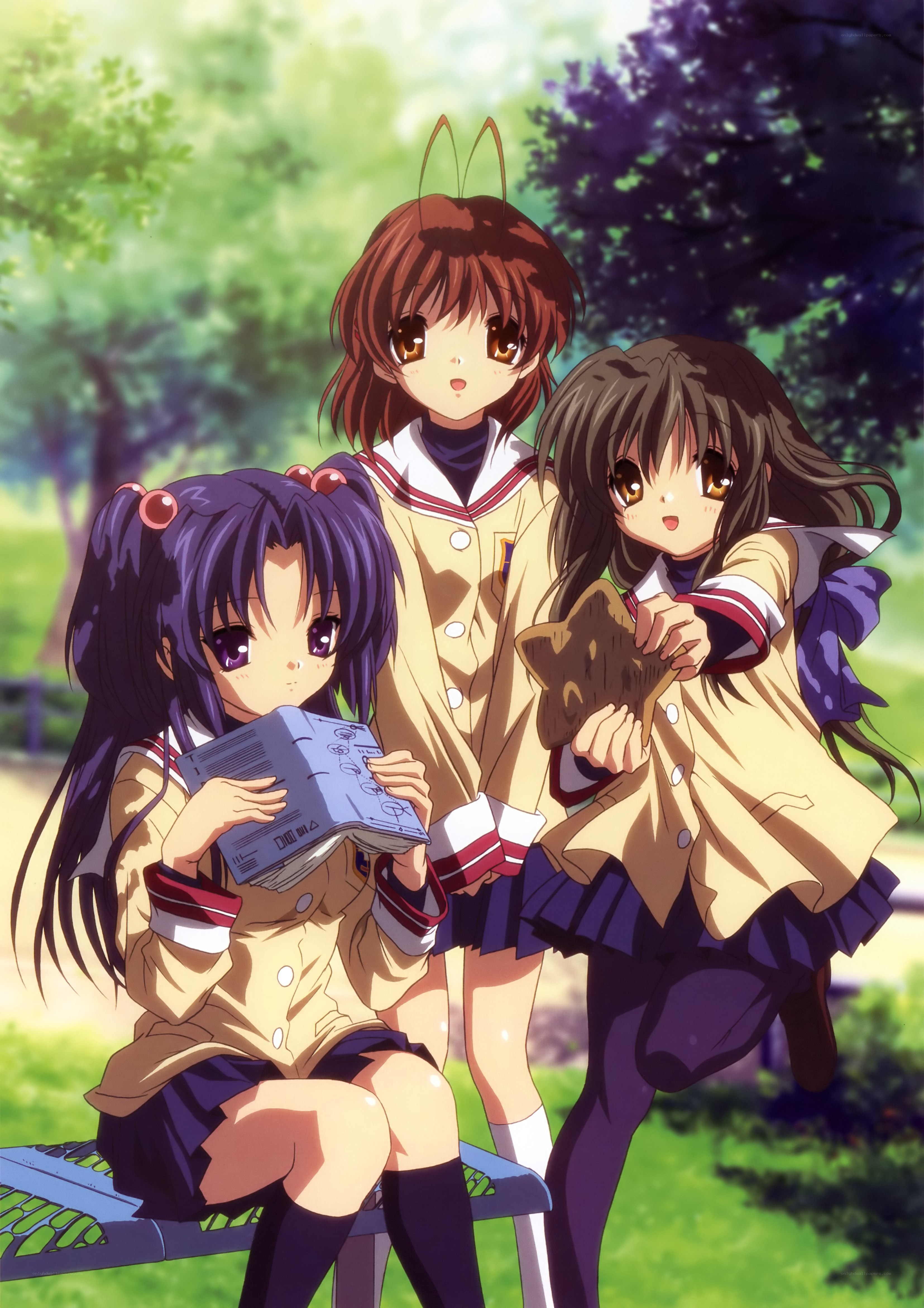 Three schoolgirls in a park