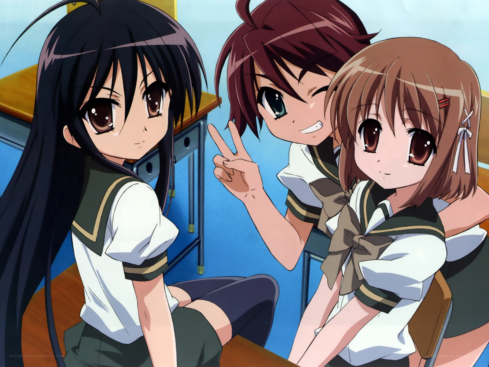 three schoolgirls in classroom