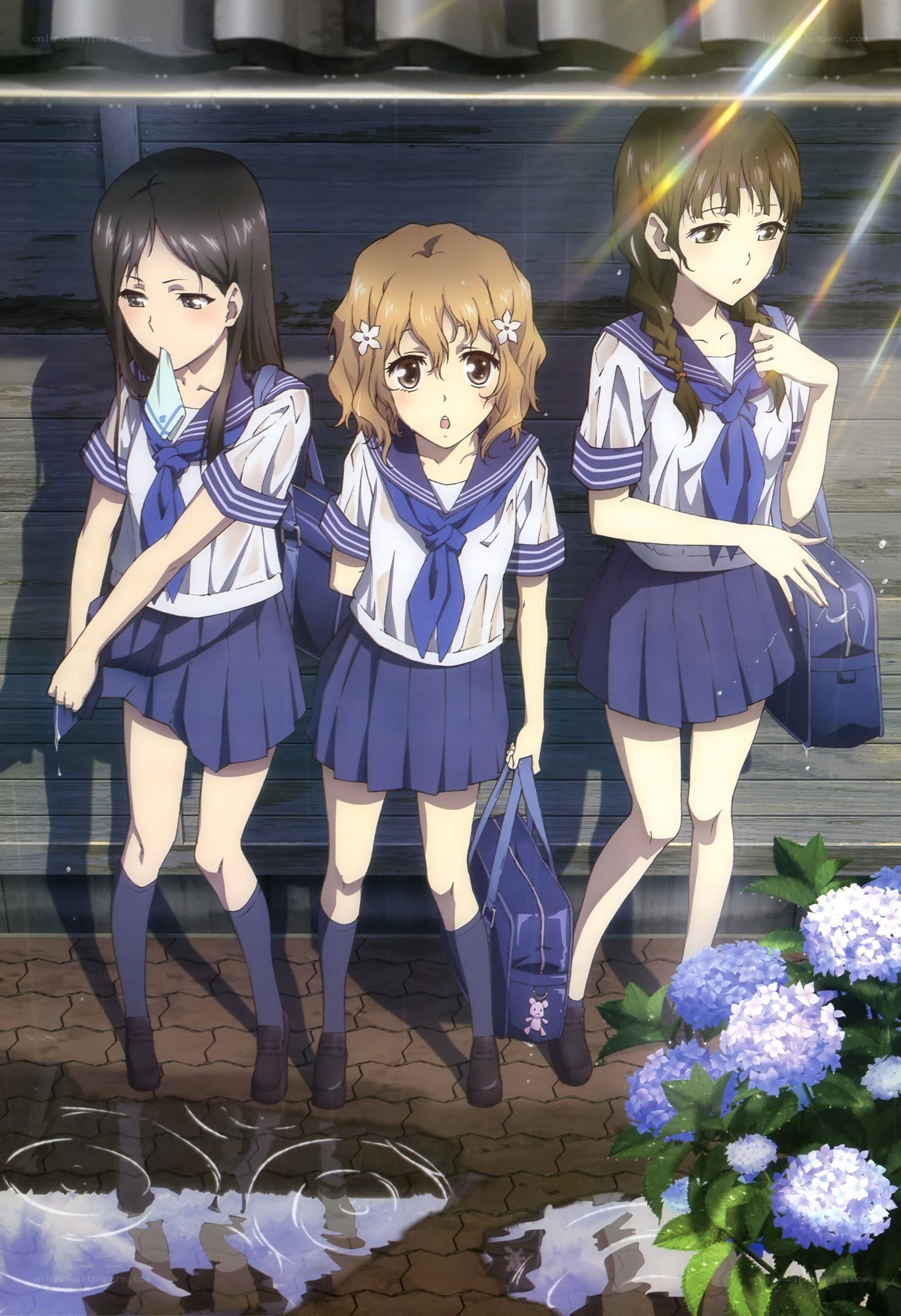 Three schoolgirls in rain