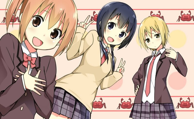 three schoolgirls posing together