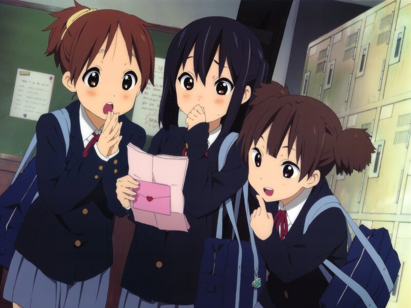 Three Schoolgirls Reading Letter
