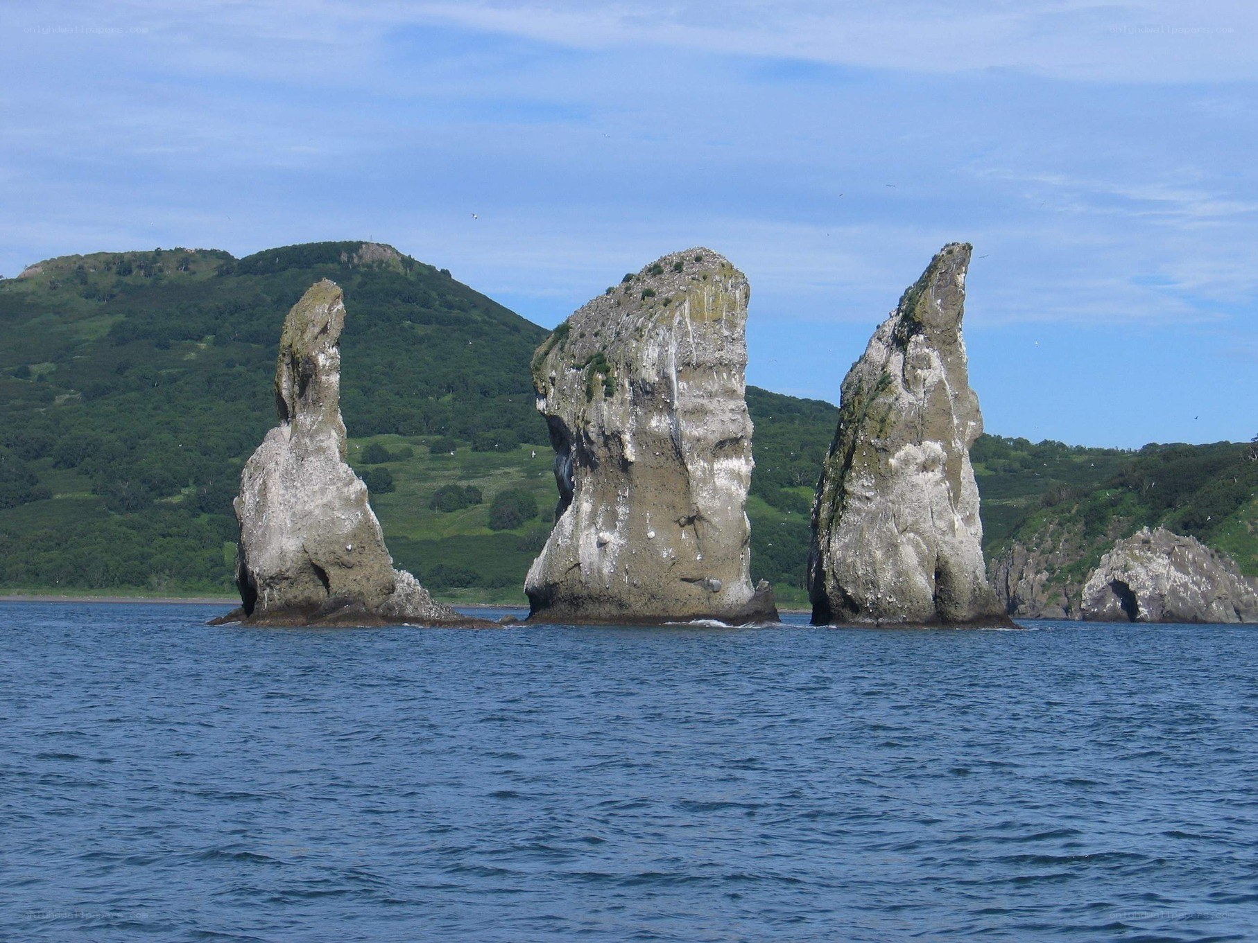 Three sea stacks in a bay