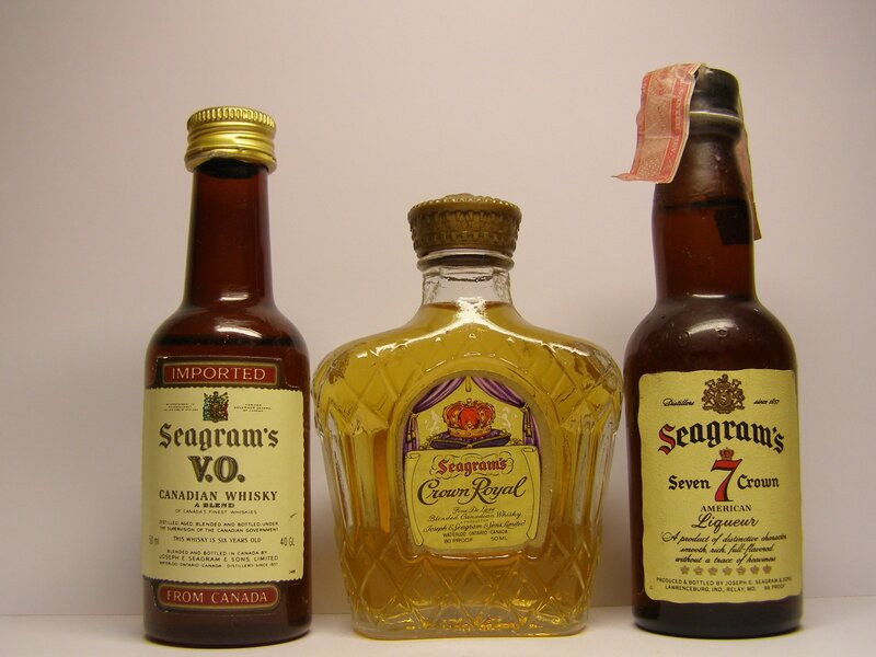 Three Seagram's whisky bottles