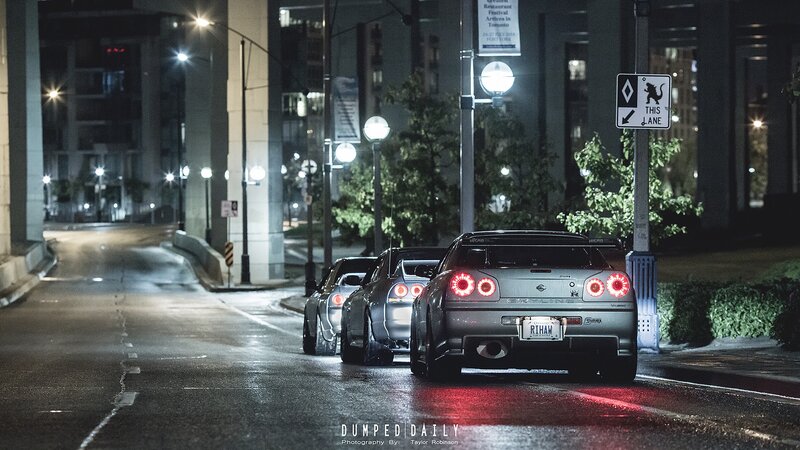 Three Silver Cars at Night