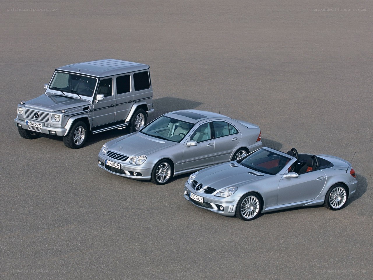 Three silver Mercedes-Benz vehicles