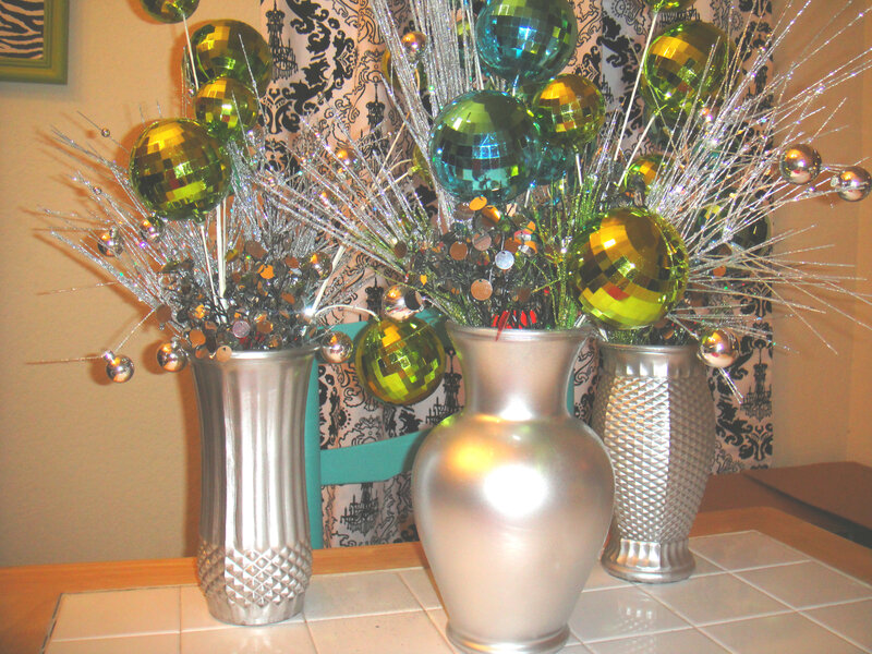 Three Silver Vases with Ornaments