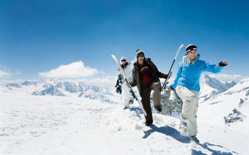Three Skiers on Mountain