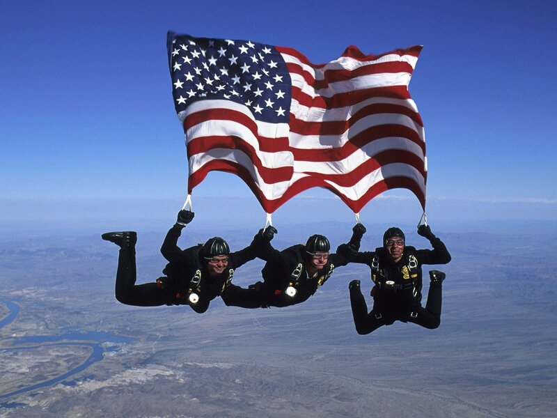 Three Skydivers with Flag