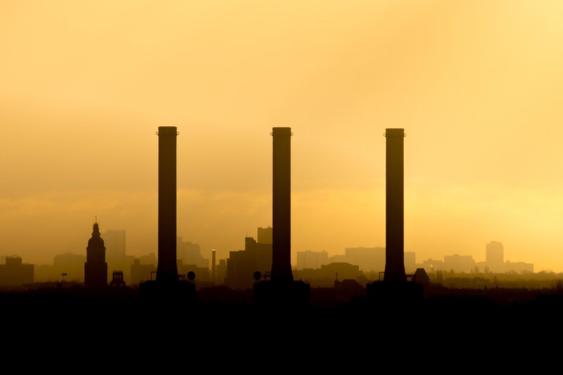 Three Smokestacks at Sunset