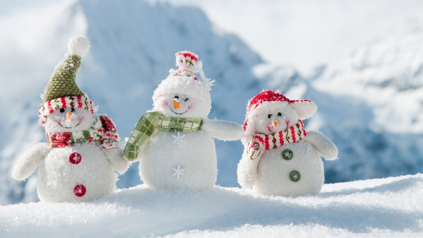 Three snowmen in winter