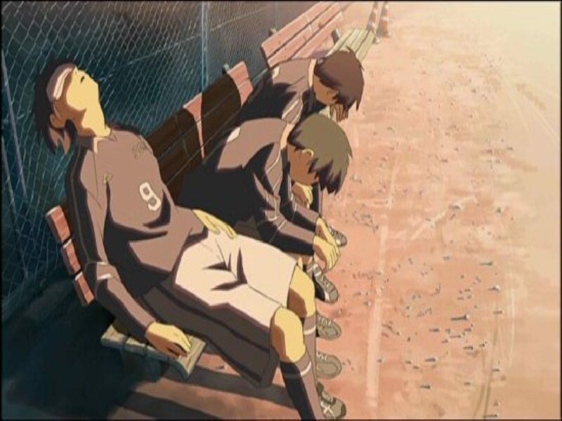 Three Soccer Players Sitting