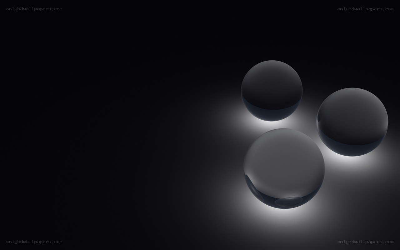 Three spheres on dark background