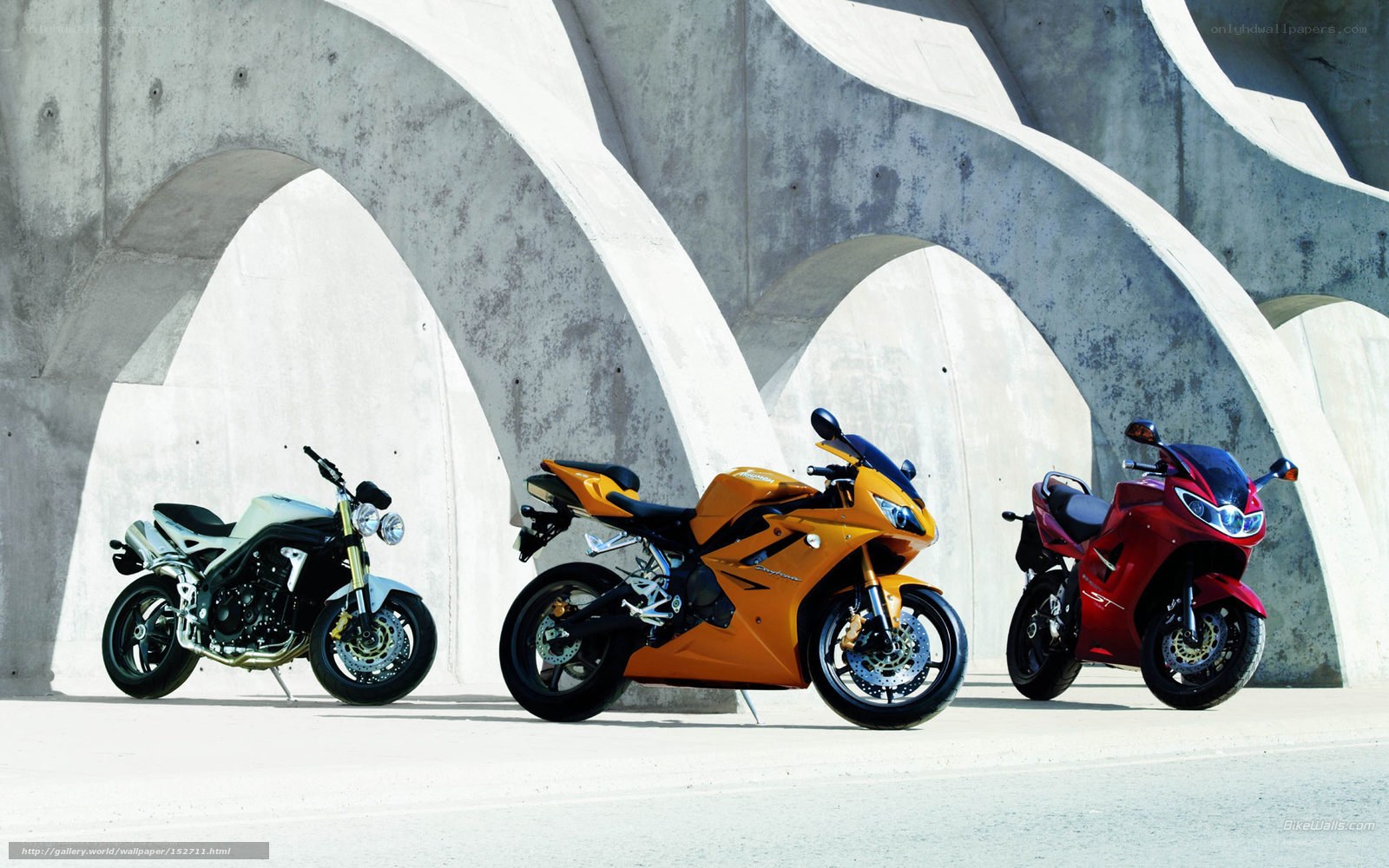 Three sport motorcycles in a row
