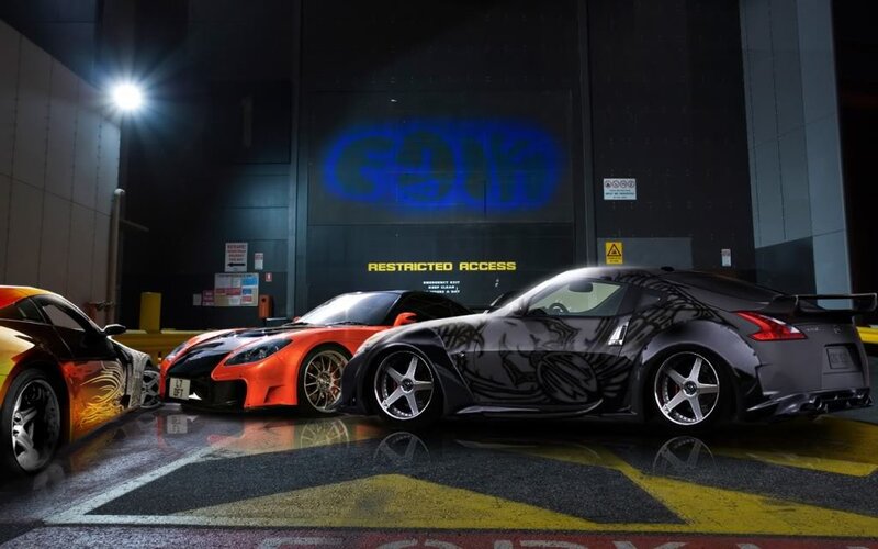 Three Sports Cars at Night
