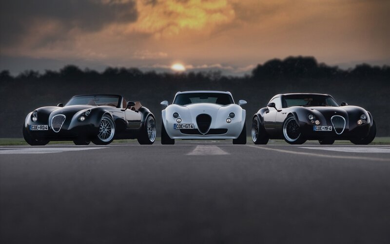 Three sports cars on a track
