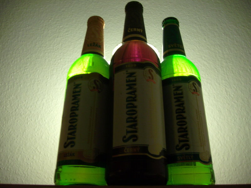 Three Staropramen beer bottles
