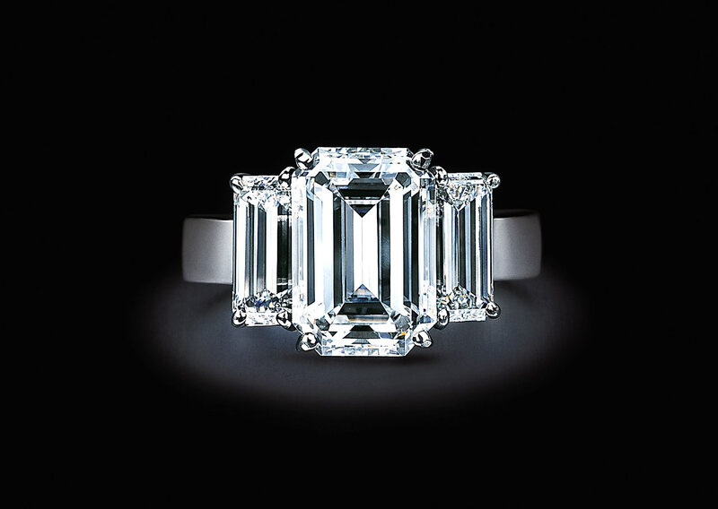 Three-stone emerald-cut diamond ring