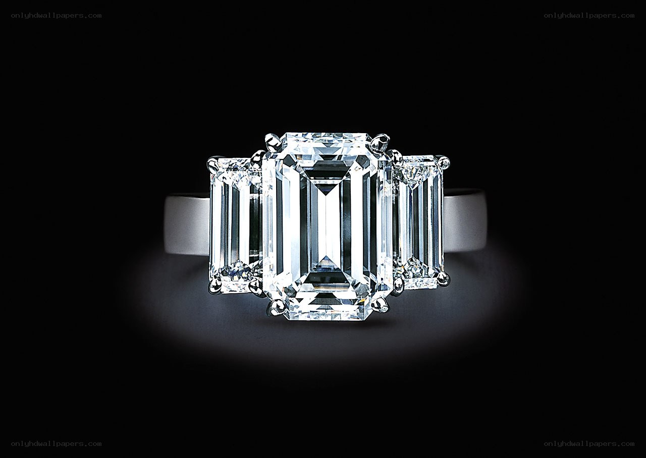 Three-stone emerald-cut diamond ring